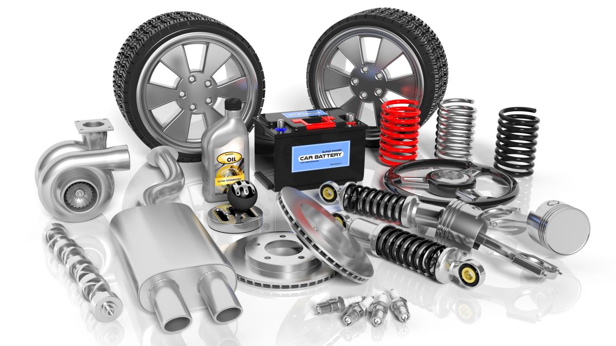 A variety of automotive parts on a white background, including tires.