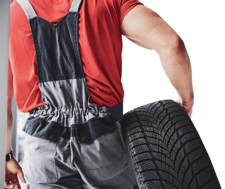 mechanic holding tire